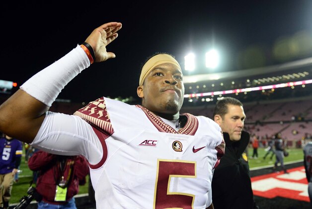 Oct 30, 2014; Louisville, KY, USA;  Florida State Seminoles quarterback Jameis Winston (5) walks off the field after defeating the Louisville Cardinals 42-31 at Papa John's Cardinal Stadium. Mandatory Credit: Andrew Weber-USA TODAY Sports