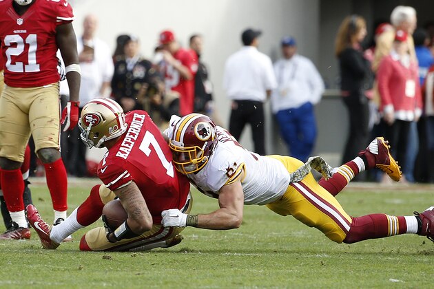 Washington Redskins outside linebacker Ryan Kerrigan, right, sacks San Francisco 49ers quarterback Colin Kaepernick during the second quarter of an NFL football game in Santa Clara, Calif., Sunday, Nov. 23, 2014. (AP Photo/Tony Avelar)