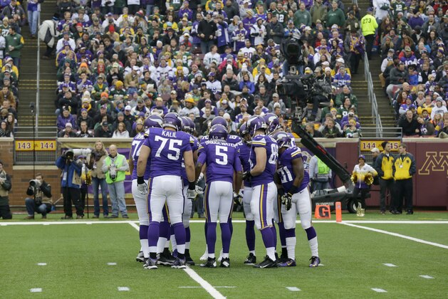 Minnesota Vikings players huddle during the first half of an NFL football game against the Green Bay Packers, Sunday, Nov. 23, 2014, in Minneapolis. (AP Photo/Ann Heisenfelt)