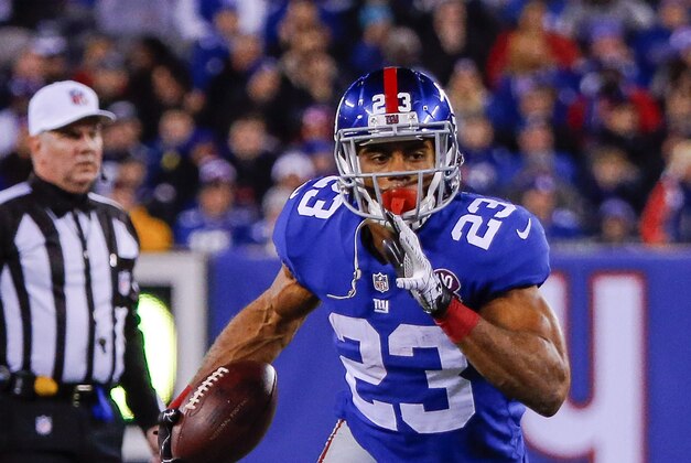 Nov 23, 2014; East Rutherford, NJ, USA;  New York Giants running back Rashad Jennings (23) runs for first down against the Dallas Cowboys during the first quarter at MetLife Stadium. Mandatory Credit: Jim O'Connor-USA TODAY Sports