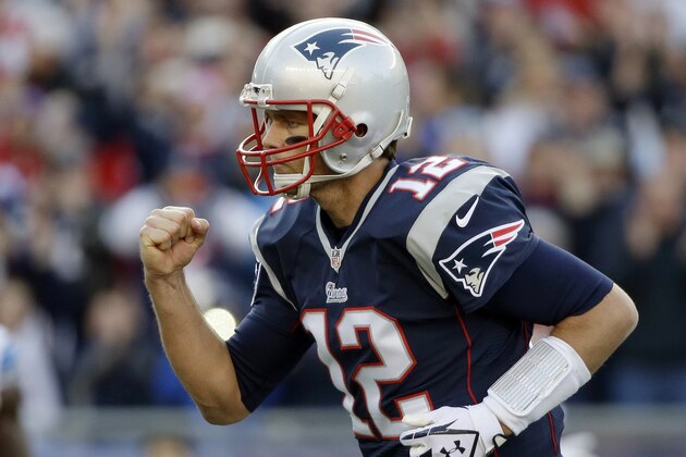New England Patriots quarterback Tom Brady celebrates his second touchdown pass to Timothy Wright in the first half of an NFL football game against the Detroit Lions, Sunday, Nov. 23, 2014, in Foxborough, Mass. (AP Photo/Steven Senne)