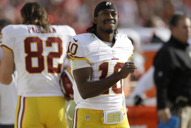 Washington Redskins quarterback Robert Griffin III (10) stands on the sideline during the second quarter of an NFL football game against the San Francisco 49ers in Santa Clara, Calif., Sunday, Nov. 23, 2014. (AP Photo/Ben Margot)