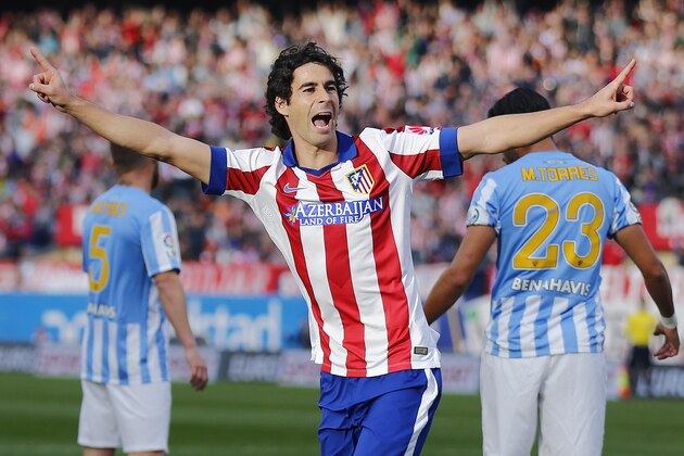 Atletico de Madrid’s Tiago from Portugal celebrates after scoring a goal during a Spanish La Liga soccer match between Atletico de Madrid and  Malaga at the Vicente Calderon stadium in Madrid, Spain, Saturday, Nov. 22, 2014 . (AP Photo/Daniel Ochoa de Olza)