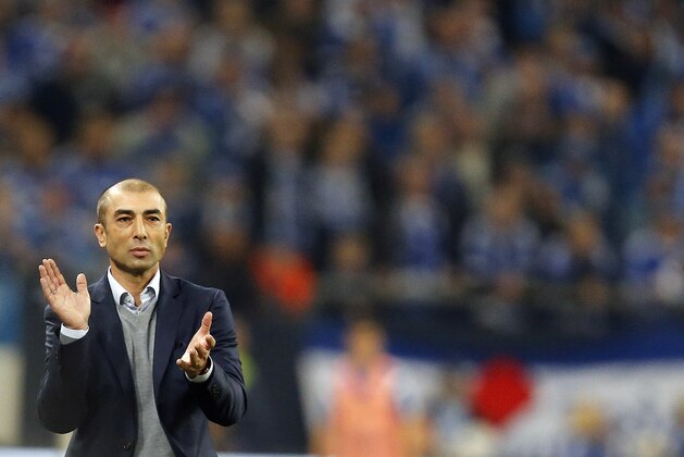 Schalke's head coach Roberto Di Matteo applauds during the German first division Bundesliga soccer match between Schalke 04 and FC Augsburg in Gelsenkirchen, Germany, Friday,Oct. 31, 2014. (AP Photo/Frank Augstein)