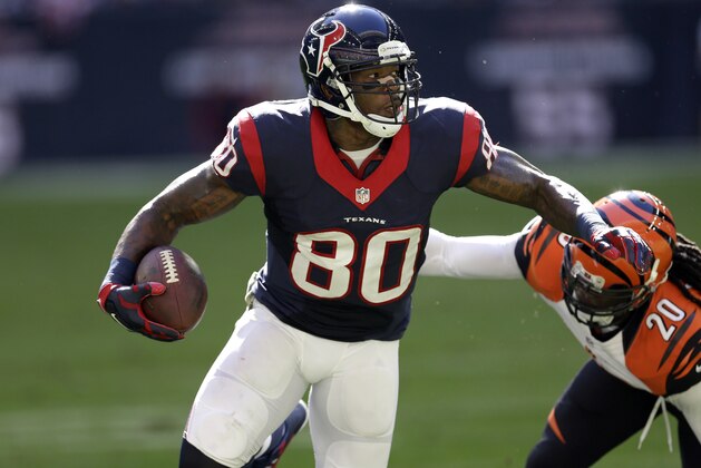 Houston Texans wide receiver Andre Johnson (80) catches a pass as Cincinnati Bengals free safety Reggie Nelson (20) defends during the second quarter of an NFL football game, Sunday, Nov. 23, 2014, in Houston. (AP Photo/David J. Phillip)