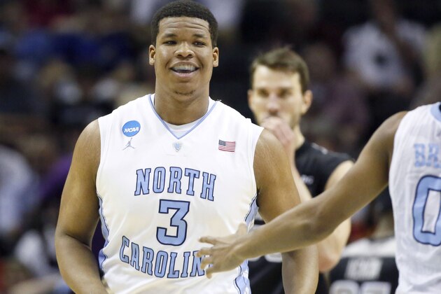 Mar 21, 2014; San Antonio, TX, USA; North Carolina Tar Heels forward Kennedy Meeks (3) smiles with North Carolina Tar Heels guard Nate Britt (0) in the first half of a men's college basketball game against the Providence Friars during the second round of the 2014 NCAA Tournament at AT&T Center. Mandatory Credit: Soobum Im-USA TODAY Sports