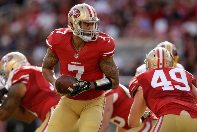 SANTA CLARA, CA - NOVEMBER 23:  Colin Kaepernick #7 of the San Francisco 49ers hands off in the first quarter against the Washington Redskins at Levi's Stadium on November 23, 2014 in Santa Clara, California.  (Photo by Ezra Shaw/Getty Images)