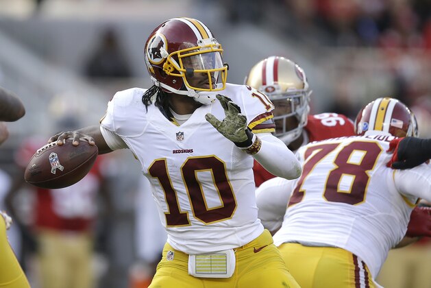 Washington Redskins quarterback Robert Griffin III (10) passes against the San Francisco 49ers during the first quarter of an NFL football game in Santa Clara, Calif., Sunday, Nov. 23, 2014. (AP Photo/Ben Margot)