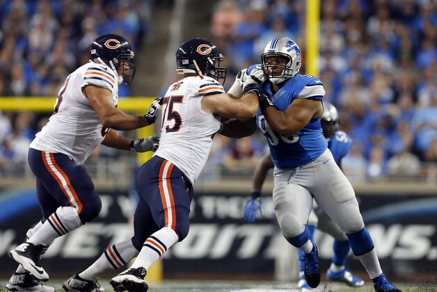Chicago Bears offensive guard Kyle Long (75) blocks Detroit Lions defensive tackle Ndamukong Suh (90) during the first quarter of an NFL football game at Ford Field in Detroit, Sunday, Sept. 29, 2013. (AP Photo/Paul Sancya)