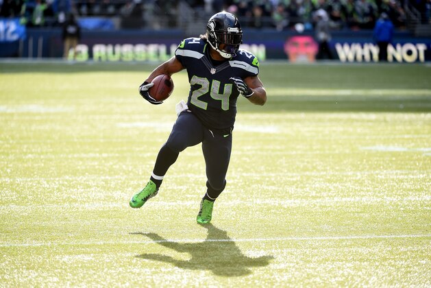 SEATTLE, WA - NOVEMBER 23:  Marshawn Lynch #24 of the Seattle Seahawks runs the ball in the first quarter against the Arizona Cardinals during their game at CenturyLink Field on November 23, 2014 in Seattle, Washington.  (Photo by Steve Dykes/Getty Images)