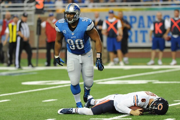 Detroit Lions defensive tackle Ndamukong Suh (90) walks away after sacking Chicago Bears quarterback Jay Cutler (6) during the second quarter of an NFL football game at Ford Field in Detroit, Sunday, Sept. 29, 2013. (AP Photo/Jose Juarez)
