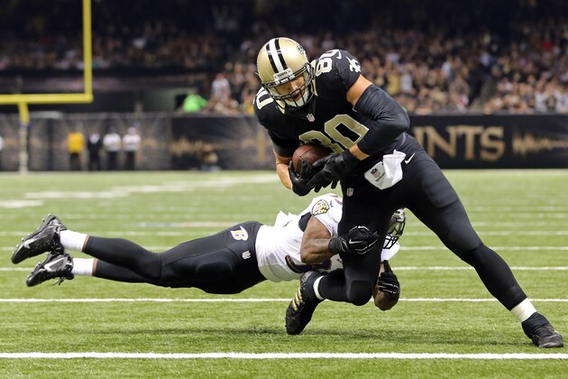 Nov 24, 2014; New Orleans, LA, USA; New Orleans Saints tight end Jimmy Graham (80) is not tackled by Baltimore Ravens strong safety Will Hill (33) on a 10-yard touchdown catch and run in the first quarter of their game at the Mercedes-Benz Superdome. Mandatory Credit: Chuck Cook-USA TODAY Sports
