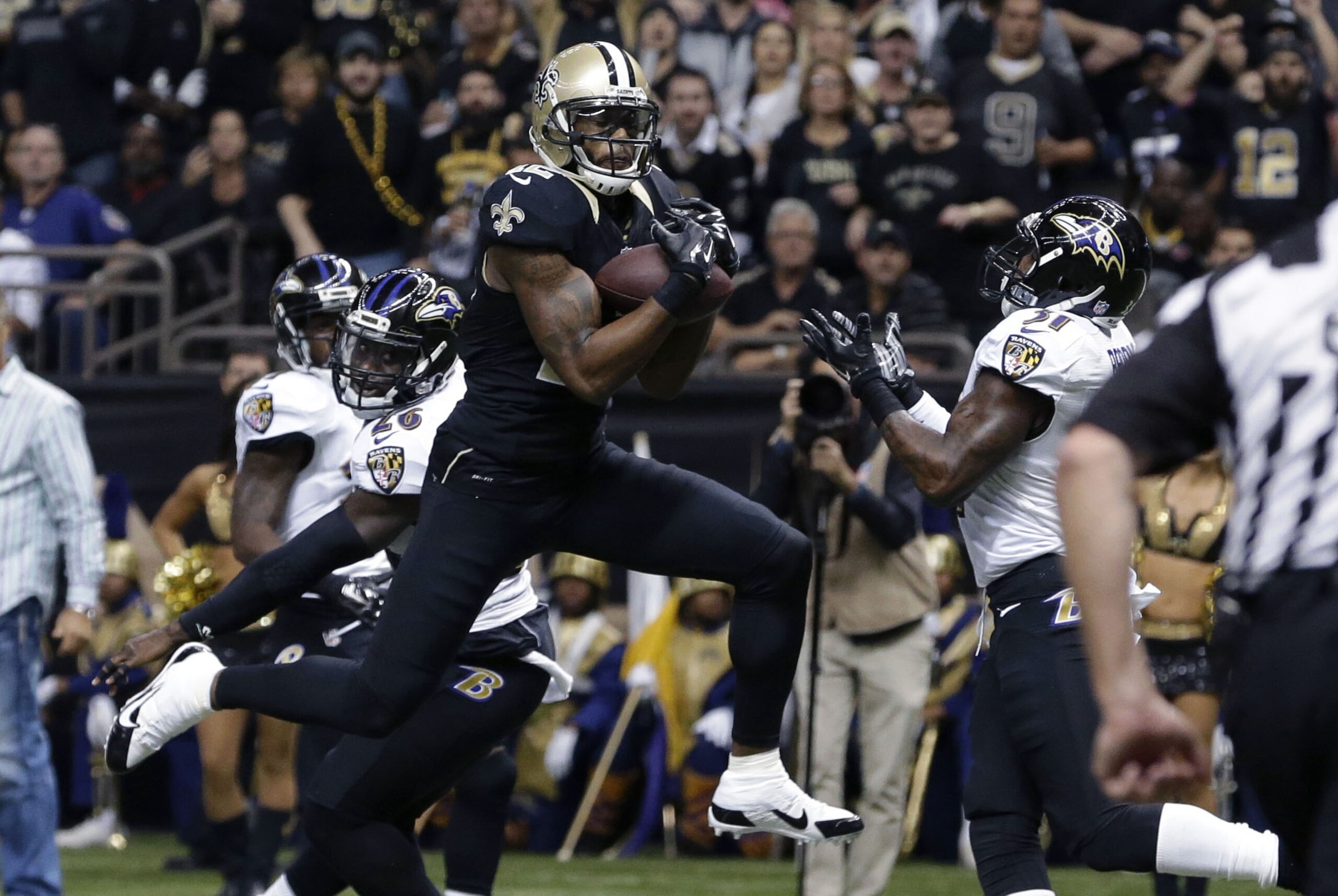 New Orleans Saints wide receiver Marques Colston (12) pulls in a touchdown reception in front of Baltimore Ravens strong safety Matt Elam (26) in the first half of an NFL football game in New Orleans, Monday, Nov. 24, 2014. (AP Photo/Jonathan Bachman) New Orleans Saints wide receiver Marques Colston (12) pulls in a touchdown reception in front of Baltimore Ravens strong safety Matt Elam (26) in the first half of an NFL football game in New Orleans, Monday, Nov. 24, 2014. (AP Photo/Jonathan Bachman)