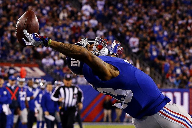 EAST RUTHERFORD, NJ - NOVEMBER 23:  Odell Beckham #13 of the New York Giants scores a touchdown in the second quarter against the Dallas Cowboys at MetLife Stadium on November 23, 2014 in East Rutherford, New Jersey.  (Photo by Al Bello/Getty Images)