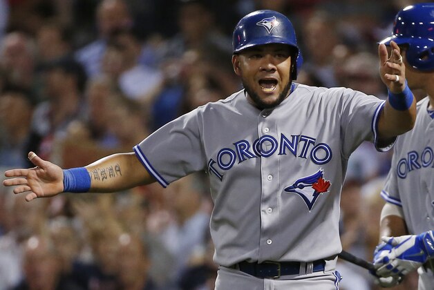 Toronto Blue Jays' Melky Cabrera argues after he was called out trying to score on a single by Dioner Navarro during the sixth inning of a baseball game against the Boston Red Sox at Fenway Park in Boston, Wednesday, July 30, 2014. (AP Photo/Elise Amendola)