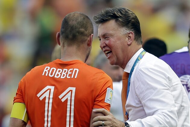 Netherlands' Arjen Robben is greeted by head coach Louis van Gaal after the World Cup round of 16 soccer match between the Netherlands and Mexico at the Arena Castelao in Fortaleza, Brazil, Sunday, June 29, 2014. The Netherlands won the match 2-1. (AP Photo/Natacha Pisarenko)