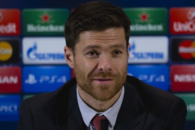 Bayern’s Xabi Alonso speaks during a press conference in Manchester, England, Monday, Nov. 24, 2014. Bayern Munich will play Manchester City on Tuesday in a Champions League Group E soccer match. (AP Photo/Jon Super)