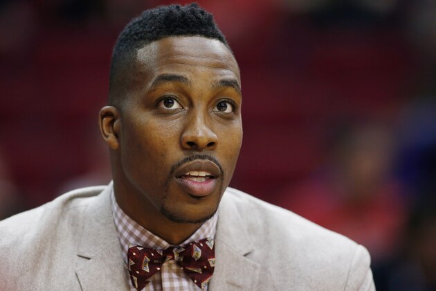 HOUSTON, TX - NOVEMBER 22:  Dwight Howard #12 of the Houston Rockets waits on the bench during their game against the Dallas Mavericks at the Toyota Center on November 22, 2014 in Houston, Texas.  NOTE TO USER: User expressly acknowledges and agrees that, by downloading and/or using this photograph, user is consenting to the terms and conditions of the Getty Images License Agreement.  (Photo by Scott Halleran/Getty Images)