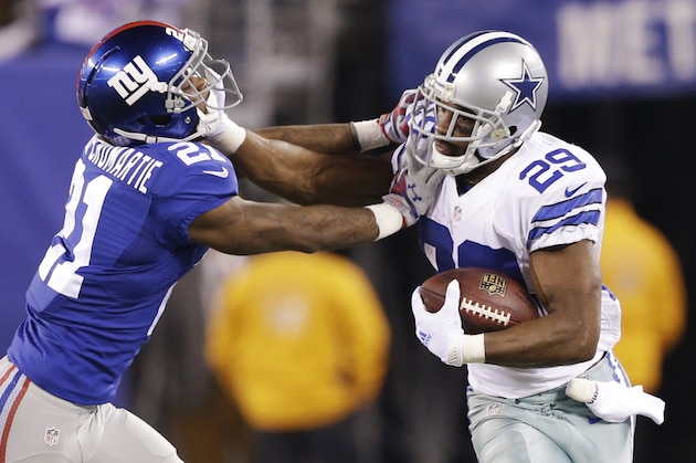 Dallas Cowboys running back DeMarco Murray (29) stiff arms New York Giants cornerback Dominique Rodgers-Cromartie (21) during the fourth quarter of an NFL football game, Monday, Nov. 24, 2014, in East Rutherford, N.J. (AP Photo/Frank Franklin II)