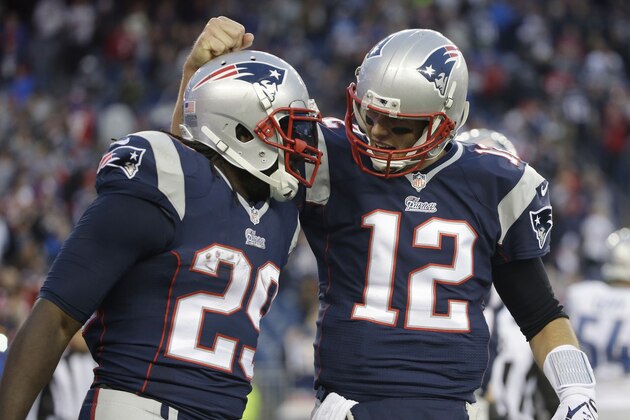 New England Patriots quarterback Tom Brady, right, congratulates running back LeGarrette Blount on his touchdown in the fourth quarter of an NFL football game against the Detroit Lions Sunday, Nov. 23, 2014, in Foxborough, Mass. The Patriots won 34-9. (AP Photo/Steven Senne)