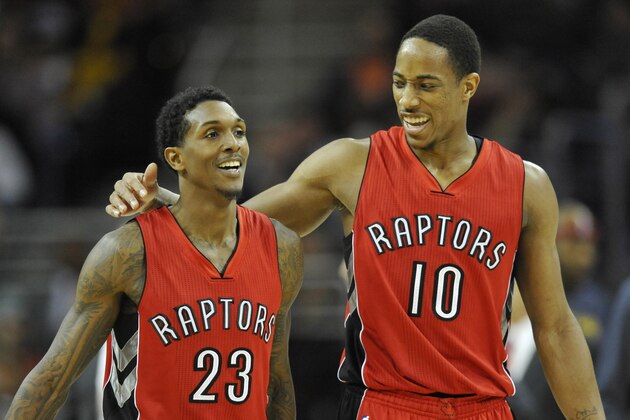Nov 22, 2014; Cleveland, OH, USA; Toronto Raptors guard DeMar DeRozan (10) hugs guard Louis Williams (23) in the third quarter against the Cleveland Cavaliers at Quicken Loans Arena. Mandatory Credit: David Richard-USA TODAY Sports