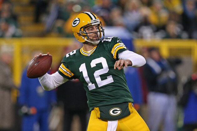GREEN BAY, WI - NOVEMBER 09: Quarterback  Aaron Rodgers #12 of the Green Bay Packers throws a 56 yard touchdown in the second quarter against the Chicago Bears at Lambeau Field on November 9, 2014 in Green Bay, Wisconsin. (Photo by Jonathan Daniel/Getty Images)