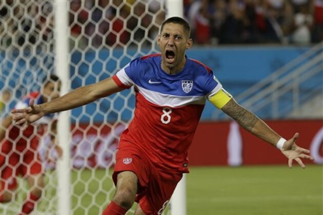 United States' Clint Dempsey celebrates after scoring the opening goal during the group G World Cup soccer match between Ghana and the United States at the Arena das Dunas in Natal, Brazil, Monday, June 16, 2014. The United States won the match 2-1. (AP Photo/Ricardo Mazalan)