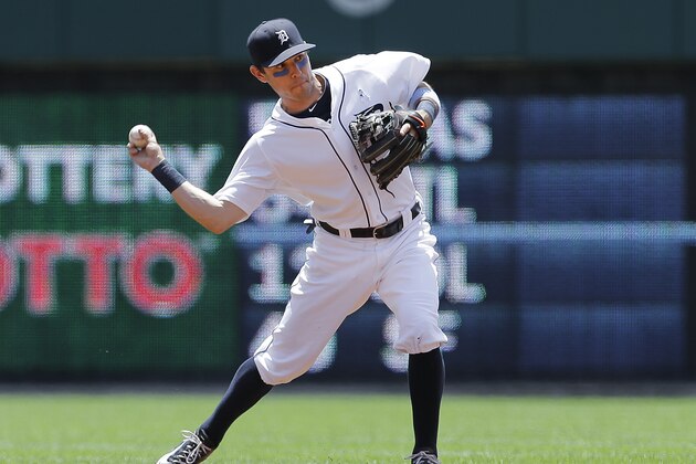 Detroit Tigers second baseman Ian Kinsler fields a ground ball against the Minnesota Twins in the first inning of a baseball game in Detroit, Sunday, June 15, 2014. (AP Photo/Paul Sancya)