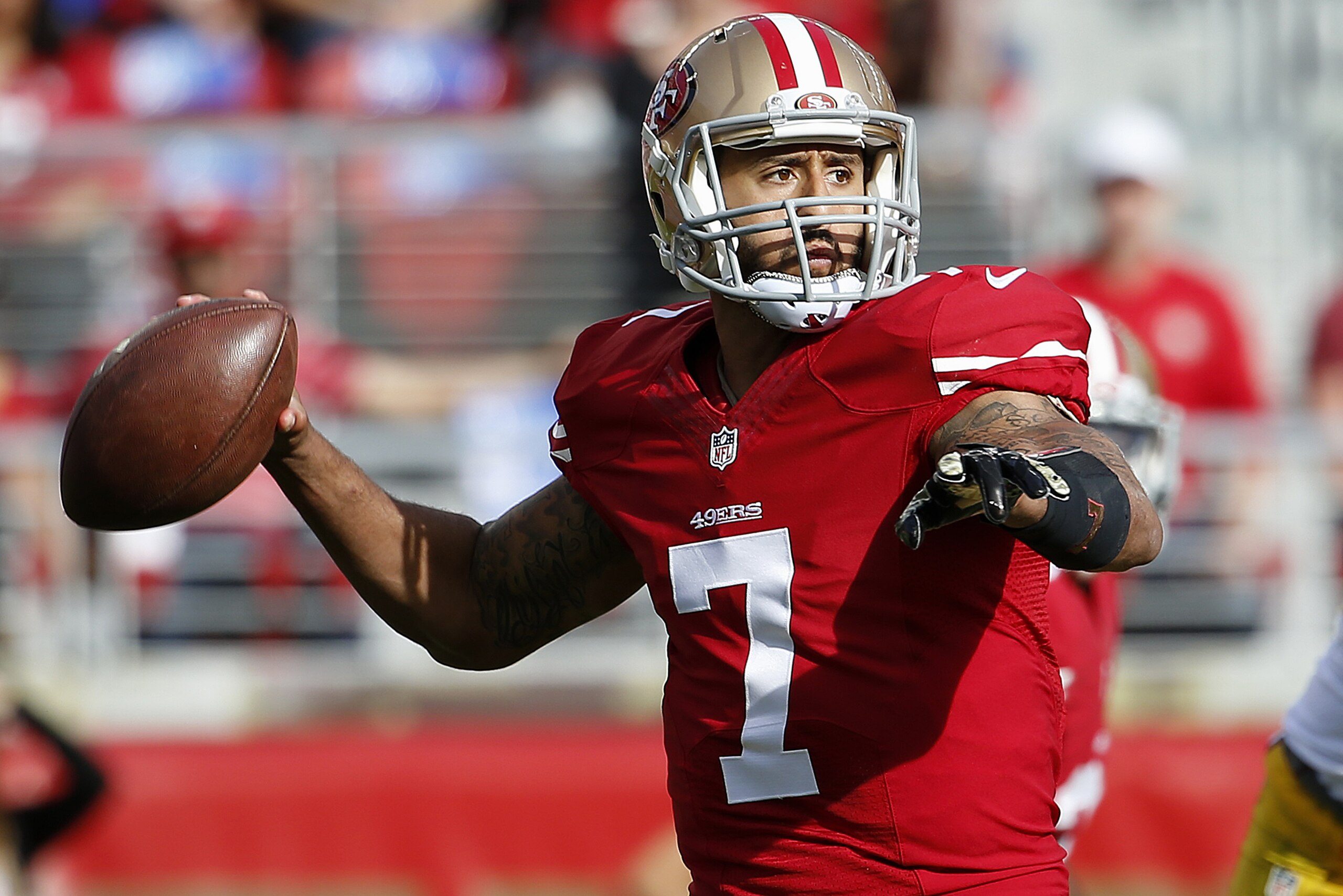 San Francisco 49ers quarterback Colin Kaepernick (7) passes against the Washington Redskins during the first quarter of an NFL football game in Santa Clara, Calif., Sunday, Nov. 23, 2014. (AP Photo/Tony Avelar)