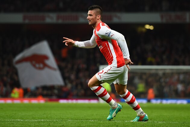 LONDON, ENGLAND - NOVEMBER 22:  Olivier Giroud of Arsenal celebrates after scoring an injury time consolation goal for Arsenal during the Barclays Premier League match between Arsenal and Manchester United at Emirates Stadium on November 22, 2014 in London, England.  (Photo by Shaun Botterill/Getty Images)
