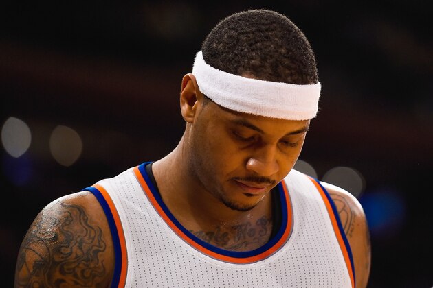 NEW YORK, NY - NOVEMBER 14: Carmelo Anthony #7 of the New York Knicks looks down during a game against the Utah Jazz at Madison Square Garden on November 14, 2014 in New York City. NOTE TO USER: User expressly acknowledges and agrees that, by downloading and/or using this photograph, user is consenting to the terms and conditions of the Getty Images License Agreement.  (Photo by Alex Goodlett/Getty Images)
