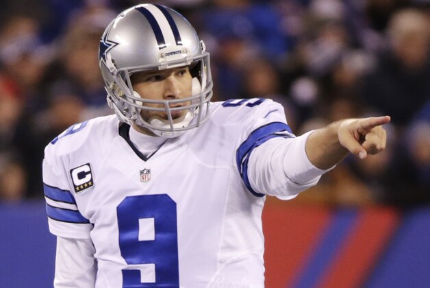 Dallas Cowboys quarterback Tony Romo (9) calls an audible at the line of scrimmage against the New York Giants in the second quarter of an NFL football game, Sunday, Nov. 23, 2014, in East Rutherford, N.J. (AP Photo/Julio Cortez)
