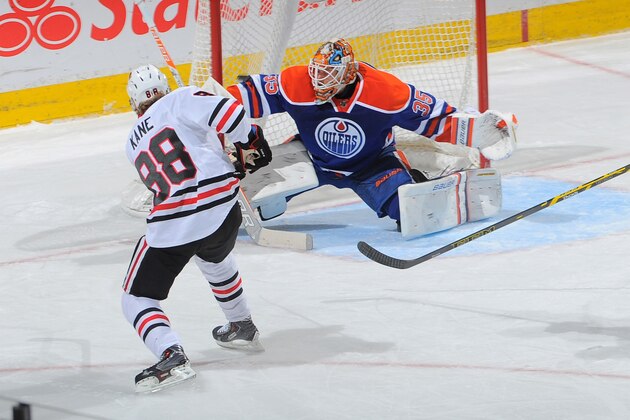 EDMONTON, AB - NOVEMBER 22: Viktor Fasth #35 of the Edmonton Oilers watches the puck go past him on a shot from Patrick Kane #88 of the Chicago Blackhawks on November 22, 2014 at Rexall Place in Edmonton, Alberta, Canada. (Photo by Andy Devlin/NHLI via Getty Images)