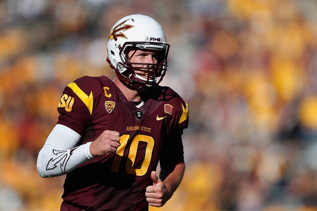 TEMPE, AZ - NOVEMBER 22:  Quarterback Taylor Kelly #10 of the Arizona State Sun Devils reacts after throwing a six yard touchdown reception to tight end Kody Kohl (not pictured) during the fourth quarter of the college football game against the Washington State Cougars at Sun Devil Stadium on November 22, 2014 in Tempe, Arizona.  The Sun Devils defeated the Cougars 52-31.  (Photo by Christian Petersen/Getty Images)