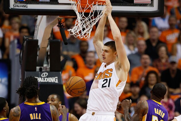 PHOENIX, AZ - OCTOBER 29:  Alex Len #21 of the Phoenix Suns slam dunks the ball against the Los Angeles Lakers during the NBA game at US Airways Center on October 29, 2014 in Phoenix, Arizona. The Suns defeated the Lakers 119-99. NOTE TO USER: User expressly acknowledges and agrees that, by downloading and or using this photograph, User is consenting to the terms and conditions of the Getty Images License Agreement.  (Photo by Christian Petersen/Getty Images)
