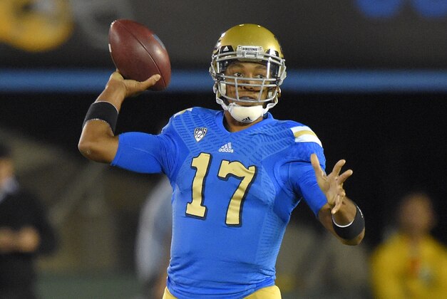 UCLA quarterback Brett Hundley passes during the first half of an NCAA college football game against Southern California, Saturday, Nov. 22, 2014, in Pasadena, Calif. (AP Photo/Mark J. Terrill)