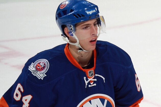 UNIONDALE, NY - SEPTEMBER 12:  Andrey Pedan #64 of the New York Islanders skates against the Boston Bruins during a rookie game exhibition at Nassau Coliseum on September 12, 2011 in Uniondale, New York. The Bruins defeated the Islanders 8-5.  (Photo by Bruce Bennett/Getty Images)
