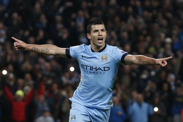 Manchester City's Sergio Aguero celebrates after scoring a penalty during the Champions League group E soccer match between Manchester City and Bayern Munich, at the Etihad Stadium, in Manchester, England, Tuesday, Nov. 25, 2014. Manchester City won 3-2 with Aguero's hat-trick. (AP Photo/Jon Super)