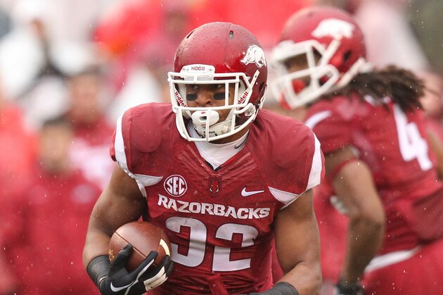 Nov 22, 2014; Fayetteville, AR, USA; Arkansas Razorbacks running back Jonathan Williams (32) rushes during the first quarter against the Ole Miss Rebels at Donald W. Reynolds Razorback Stadium. Mandatory Credit: Nelson Chenault-USA TODAY Sports