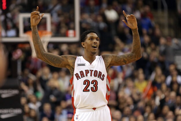 Nov 21, 2014; Toronto, Ontario, CAN; Toronto Raptors guard Lou Williams (23) celebrates a basket against the Milwaukee Bucks at Air Canada Centre. The Raptors beat the Bucks 124-83. Mandatory Credit: Tom Szczerbowski-USA TODAY Sports