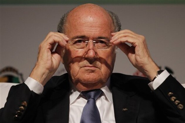 FILE - In this July 2, 2014 file photo, FIFA President Sepp Blatter puts on his glasses as he prepares to speak about the World Cup's impact on Brazilian soccer, during a sports management seminar at the Maison de France theater in downtown Rio de Janeiro, Brazil. Blatter will run for a fifth, four-year term as FIFA president.