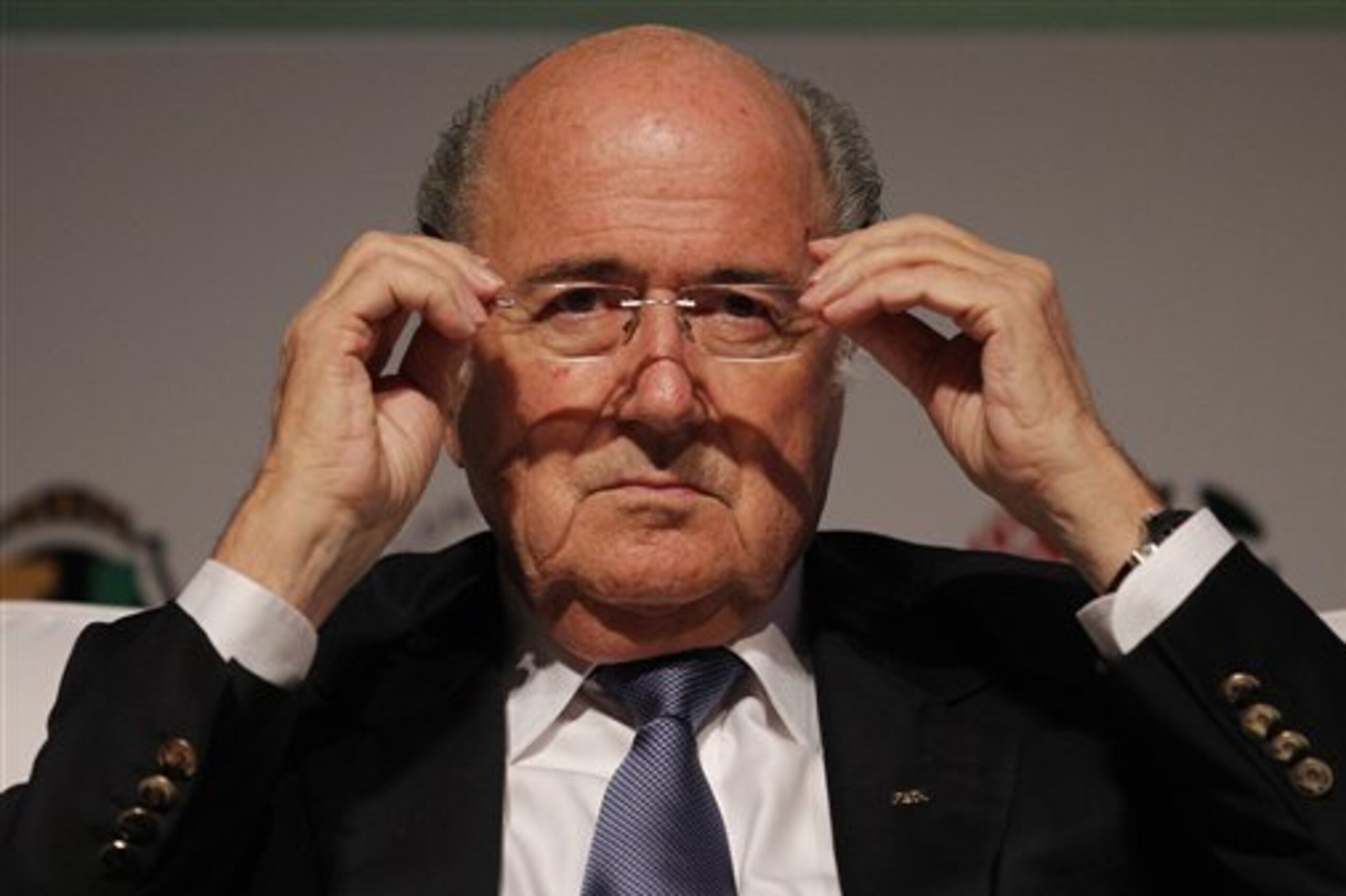 FILE - In this July 2, 2014 file photo, FIFA President Sepp Blatter puts on his glasses as he prepares to speak about the World Cup's impact on Brazilian soccer, during a sports management seminar at the Maison de France theater in downtown Rio de Janeiro, Brazil. Blatter will run for a fifth, four-year term as FIFA president. FILE - In this July 2, 2014 file photo, FIFA President Sepp Blatter puts on his glasses as he prepares to speak about the World Cup's impact on Brazilian soccer, during a sports management seminar at the Maison de France theater in downtown Rio de Janeiro, Brazil. Blatter will run for a fifth, four-year term as FIFA president.