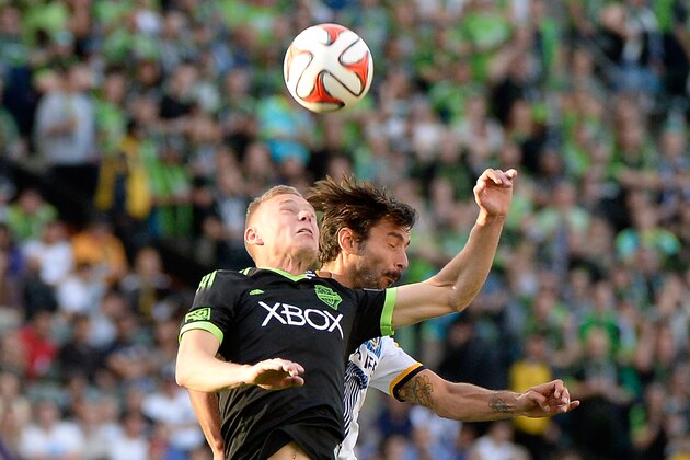 LOS ANGELES, CA - NOVEMBER 23:  Andy Rose #5 of Seattle Sounders FC and Baggio Husidic #6 of Los Angeles Galaxy head the ball during a 2-1 Galaxy win in the Western Conference Final at StubHub Center on November 23, 2014 in Los Angeles, California.  (Photo by Harry How/Getty Images)