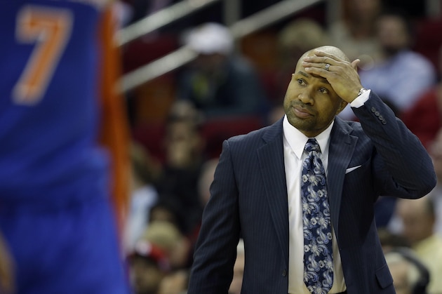 New York Knicks coach Derek Fisher watches his team play the Houston Rockets during the second quarter of an NBA basketball game Monday, Nov. 24, 2014, in Houston. (AP Photo/David J. Phillip)