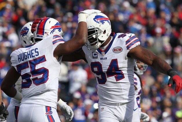 Oct 19, 2014; Orchard Park, NY, USA; Buffalo Bills defensive end Mario Williams (94) celebrates a sack with teammate defensive end Jerry Hughes (55) during the first half against the Minnesota Vikings at Ralph Wilson Stadium. Mandatory Credit: Timothy T. Ludwig-USA TODAY Sports