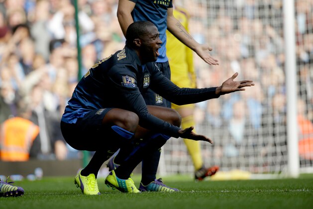 Manchester City's Yaya Toure reacts to a decision from the referee during the English Premier League soccer match between West Ham and Manchester City at Upton Park stadium in London, Saturday, Oct. 25, 2014.  (AP Photo/Matt Dunham)