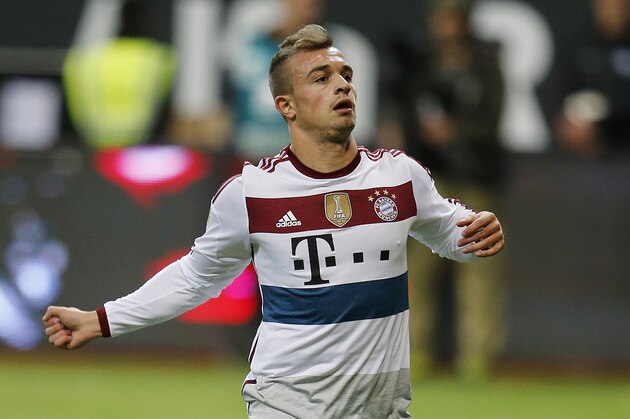 Bayern's Xherdan Shaqiri celebrates his side's fourth goal during the German first division Bundesliga soccer match between Eintracht Frankfurt and Bayern Munich in the Commerzbank Arena in Frankfurt, Germany, Saturday, Nov. 8, 2014. (AP Photo/Michael Probst)