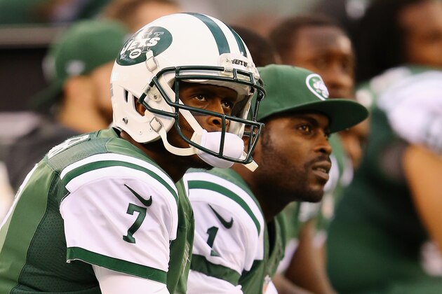 EAST RUTHERFORD, NJ - OCTOBER 26:  Quarterbacks Geno Smith #7 of the New York Jets and Michael Vick #1 look on from the bench in the fourth quarter against the Buffalo Bills at MetLife Stadium on October 26, 2014 in East Rutherford, New Jersey. The Bills won 43-23.  (Photo by Al Bello/Getty Images)