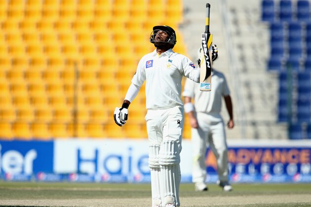 ABU DHABI, UNITED ARAB EMIRATES - NOVEMBER 12:  Mohammad Hafeez of Pakistan celebrates reaching his century during day four of the first test between Pakistan and New Zealand at Sheikh Zayed Stadium on November 12, 2014 in Abu Dhabi, United Arab Emirates.  (Photo by Warren Little/Getty Images)