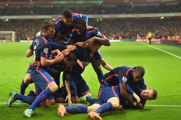 LONDON, ENGLAND - NOVEMBER 22:  Wayne Rooney of Manchester United celebrates scoring his team's second goal with team mates during the Barclays Premier League match between Arsenal and Manchester United at Emirates Stadium on November 22, 2014 in London, England.  (Photo by Michael Regan/Getty Images)
